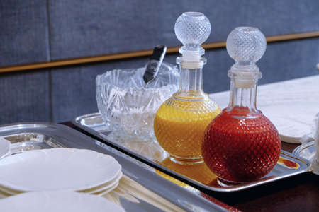 Ripe mango juice and strawberry juice in the bottles prepared for servingの写真素材