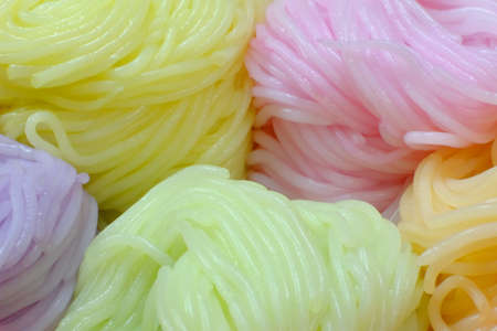 Colorful pastel color rolled noodles prepared for cooking