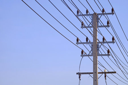 Electrical pole and wires with the clear blue sky backgroundの写真素材