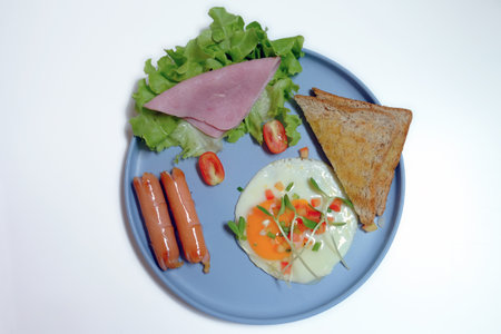 Top view American breakfast in a dish on white backgroundの写真素材