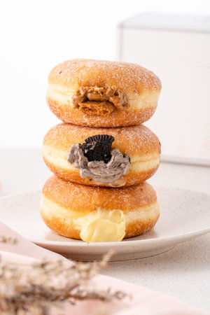 A bombolone or bomboloni is an Italian filled doughnut and is eaten as a snack food and dessert. This Bomboloni has many flavors like strawberry, chocolate, blueberry, etc.の写真素材