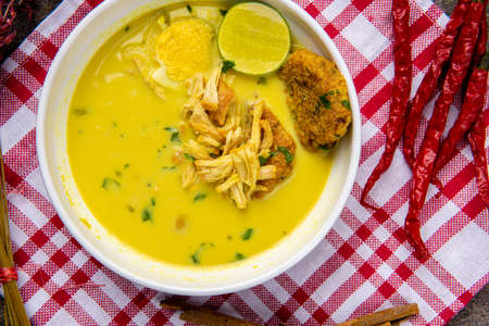 Nasi Soto Ayam or Soto Medan is  Traditional chicken soup with rice from Medan, North Sumatra. 

Soto is a traditional Indonesian soup mainly composed of broth, meat, fried patties and vegetables.の写真素材