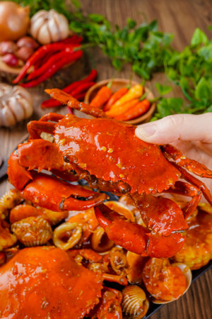 Delicious Crab in Padang sauce or Padang crab is an Indonesian seafood dish of crab served in hot and spicy Padang sauce.の写真素材