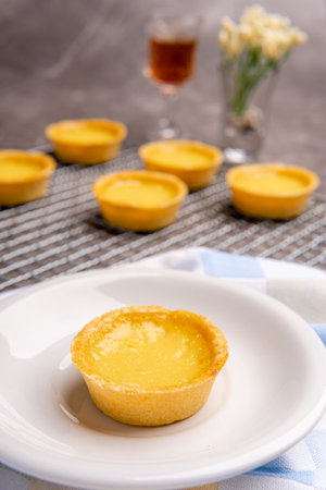 The egg tart  is a kind of custard tart found in Cantonese cuisine derived from the English custard...