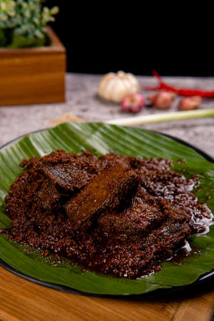 Beef Rendang is a Minang dish originating from the Minangkabau region in West Sumatra, Indonesia.  Rendang has been slow cooked and braised in a coconut milk seasoned with a herb and spice mixtureの写真素材