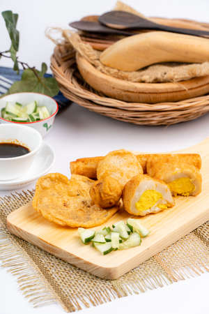 Pempek or empek-empek is a savoury Indonesian fishcake delicacy, made of fish and tapioca, from Palembang South Sumatera, Indonesia. Pempek is served with rich sweet and sour sauce called kuah cukoの写真素材