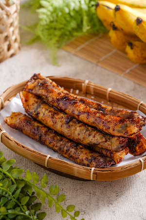 Piscok or banana chocolate is  traditional snacks from Indonesia. made of fried banana wrapped in spring roll skin.の写真素材