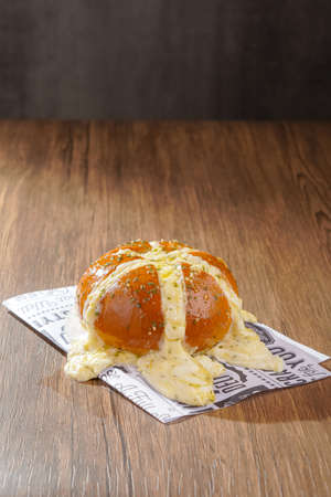 Korean Garlic bread consists of bread topped with garlic and olive oil or butter and may include additional herbs, such as oregano or chives. It is then either grilled in bread oven.の写真素材