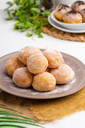 delicious homemade mini doughnut or donut. 

Donut is popular in many countries and is prepared in various forms as a sweet snack that can be homemade or purchased in bakeries, supermarkets.の写真素材