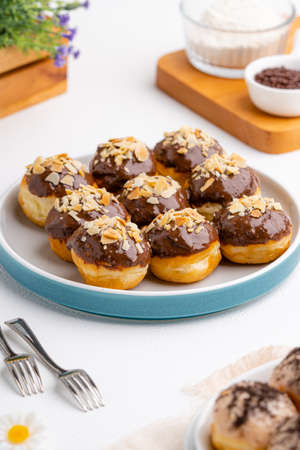 delicious homemade mini doughnut or donut. 

Donut is popular in many countries and is prepared in various forms as a sweet snack that can be homemade or purchased in bakeries, supermarkets.の写真素材