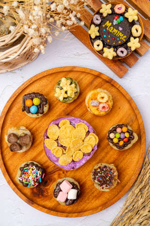 Martabak Mini or Martabak Mini Bangka with various Topping. The martabak mini bangka is made from a...