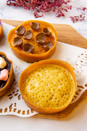 Kue Hok Lo Pan or Martabak Mini Bangka with various Topping. The martabak mini bangka is made from a...