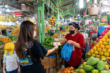 BERASTAGI, INDONESIA - SEPTEMBER 28,2021. Berastagi Fruit Market, North Sumatra a regionally famous traditional market selling local fruits souvenirs. Berastagi is famous for its passion fruit.のeditorial素材