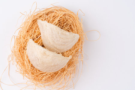 Top Grade edible bird nest shoot on white background with negative space. Raw edible bird's nest materials for tradition chinese medicine. Swallow nest the traditional chinese delicacy.の写真素材