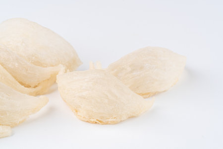 Top Grade edible bird nest shoot on white background with negative space. Raw edible bird's nest materials for tradition chinese medicine. Swallow nest the traditional chinese delicacy.の写真素材