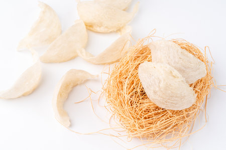 Top Grade edible bird nest shoot on white background with negative space. Raw edible bird's nest materials for tradition chinese medicine. Swallow nest the traditional chinese delicacy.の写真素材