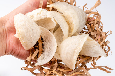 Top Grade edible bird nest shoot on white background with negative space. Raw edible bird's nest materials for tradition chinese medicine. Swallow nest the traditional chinese delicacy.の写真素材
