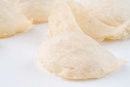 Top Grade edible bird nest shoot on white background with negative space. Raw edible bird's nest materials for tradition chinese medicine. Swallow nest the traditional chinese delicacy.の写真素材
