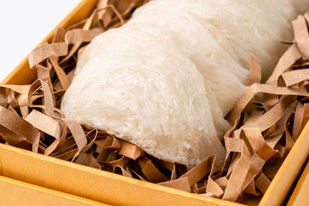Top Grade edible bird nest shoot on white background with negative space. Raw edible bird's nest...
