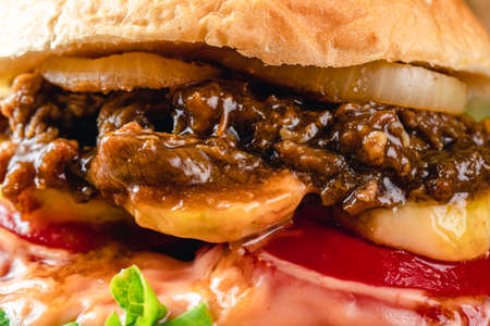 Fresh grilled homemade burgers with beef, tomato, fried egg, cheese and lettuce on rustic wooden background. fast food and junk food concept. fresh tasty burger on dark background.の写真素材