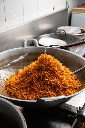 Dried potato or potato mustofa (indonesian : Kering Kentang Potato Balado) is the term for dry match-shaped potatoes stir-fried with Indonesian spices.の写真素材