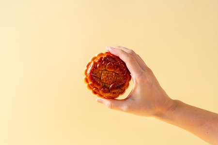 A mooncake  is a Chinese bakery product traditionally eaten during the Mid-Autumn Festival.の写真素材