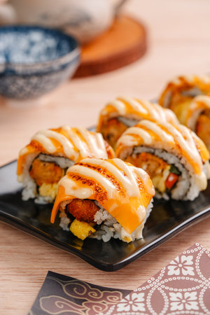 sushi is a Japanese dish of prepared vinegared rice, usually with some sugar and salt, accompanied by a variety of ingredients such as seafood, often raw and vegetables.の写真素材