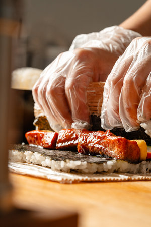 sushi is a Japanese dish of prepared vinegared rice, usually with some sugar and salt, accompanied by a variety of ingredients such as seafood, often raw and vegetables.の写真素材