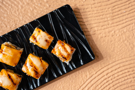 sushi is a Japanese dish of prepared vinegared rice, usually with some sugar and salt, accompanied by a variety of ingredients such as seafood, often raw and vegetables.の写真素材