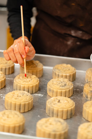Mooncake making process. A mooncake  is a Chinese bakery product traditionally eaten during the Mid-Autumn Festival.の写真素材