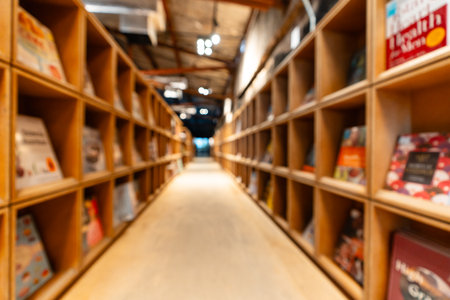 Abstract blurred public library interior space. blurry room with bookshelves by defocused effect. use for background or backdrop in business or education conceptsの写真素材