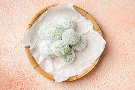 kelepon or klepon or onde-onde made from glutinous rice flour and filled with brownn sugar covered with grated coconut.の写真素材