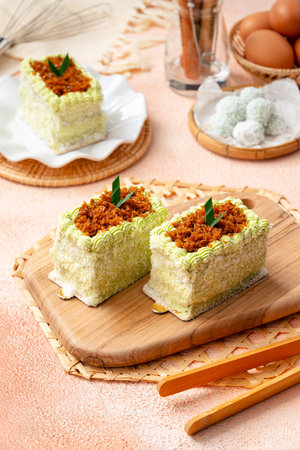 kelepon or klepon cake made from glutinous rice flour and filled with brown sugar covered with grated coconut.の写真素材