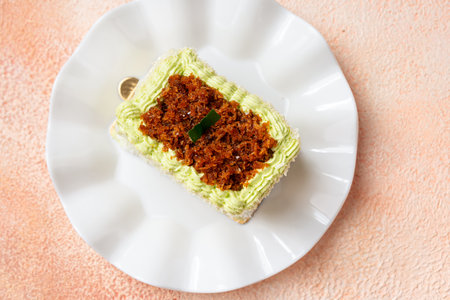 kelepon or klepon cake made from glutinous rice flour and filled with brown sugar covered with grated coconut.の写真素材