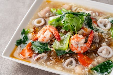 kwetiau siram is Chinese cuisine which is popular in Indonesia, cooked by frying added with...