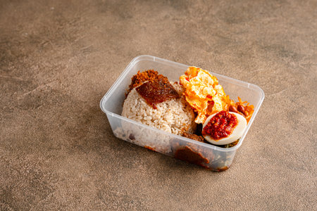 In Indonesian it is called Rice Box or Nasi kotak contains pork rendang and Pork jerky (Indonesian Dendeng Babi). Usually distributed during celebrations or catering packaging.の写真素材
