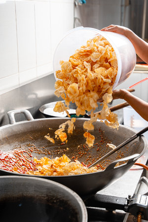 making process Emping Balado, Spicy Snacks from West Sumatra. Made from melinjo crackers, it's...