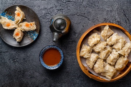 Assorted Chinese Dimsum in bamboo basket. Dimsum is a large range of small dishes that Cantonese people traditionally enjoy in restaurants for breakfast and lunch.の写真素材