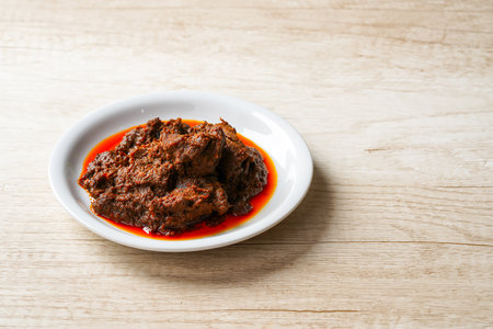 Rendang Pork. Rendang is an Indonesian West Sumatra Minangkabau spicy meat. that slow cooked in coconut milk and mixed spices.の写真素材