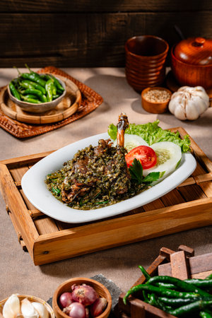 Bebek goreng cabe ijo or fried duck with green chili sauce. Traditional cuisine from West Sumatra, Indonesia.の写真素材