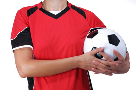 photography of a bust of a woman in uniform holding a soccer ballの写真素材
