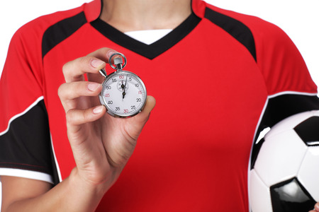 photography of a female bust in Football Uniform holding and showing a stopwatchの写真素材