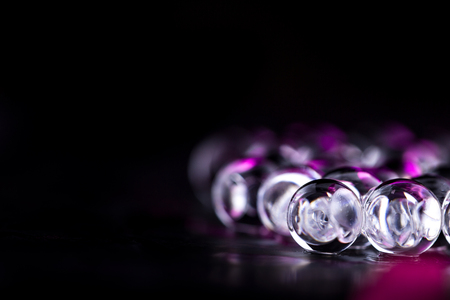 Violet and dark water gel balls. Macro photo, can be used both for advertising or cosmetics and for...