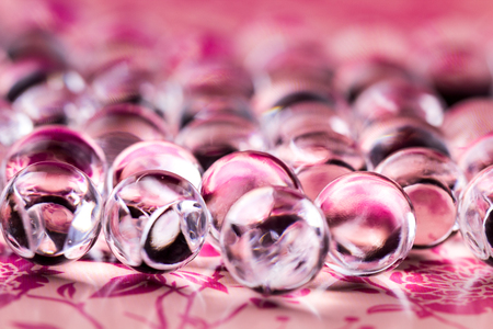 Violet pastel water gel balls. Macro photo, can be used both for advertising or cosmetics and for medicine. Abstract background.の写真素材
