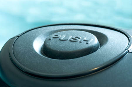 A macro of a button that says push.