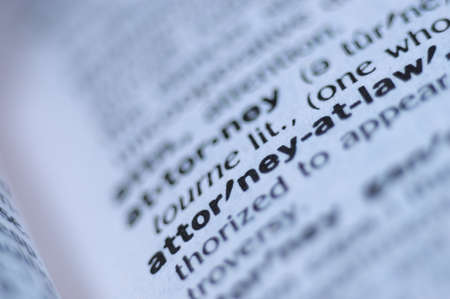 Extreme macro or close up of the words ATTORNEY AT LAW Very shallow depth of field is intentional and shows only the words attorney at law in focus.の写真素材