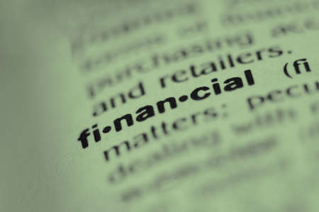 Extreme macro or close up of the word FINANCIAL. Very shallow depth of field is intentional and shows only the word financial in focus.の写真素材