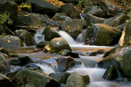 A small secluded cascade in the forests of Virginia. Taken with a slow shutter speed to smooth and soften the water.  One of many waterfalls in my collection.の写真素材