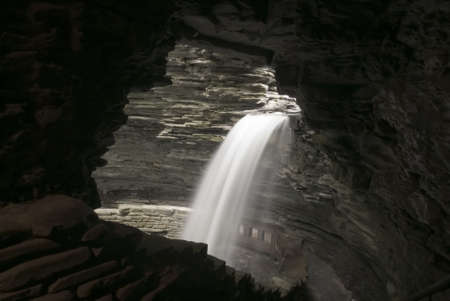 A waterfall at Watkins Glen state park in New York viewed from a cavern. You can walk behind this waterfall.の写真素材
