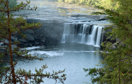 Cumberland falls in Kentucky.  This waterfall  is located near the city of Corbin in Cumberland falls state park.  Photo was taken in mid October during a drought. Even with a drought the waterfall is impressive. の写真素材